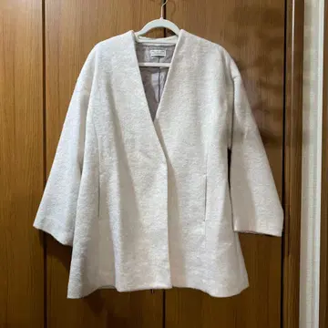 크림색 노카라 자켓