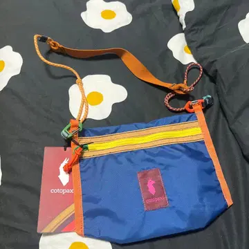 Cotopaxi 코토팍시 숄더백 사코슈 델 디아 컬러풀