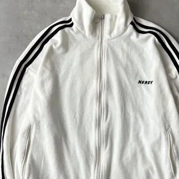 15194 NERDY 파일 원단 트랙 자켓 저지 화이트 컬러