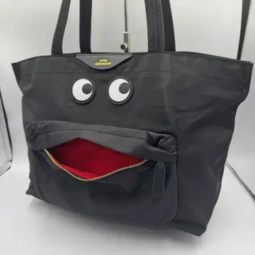 안야 힌드마치 블랙 나일론 토트 페이스 눈 모티브