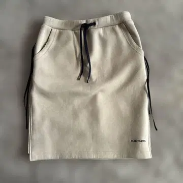 베이지 타이트 스커트 포켓 부착