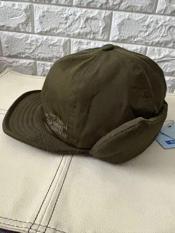 TESTIFY 귀마개 달린 올리브 캡