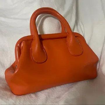 핸드백 오렌지 파카파카 입구