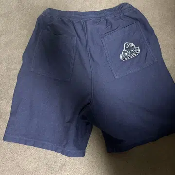 XLARGE x Champion 하프 스웨트 팬츠