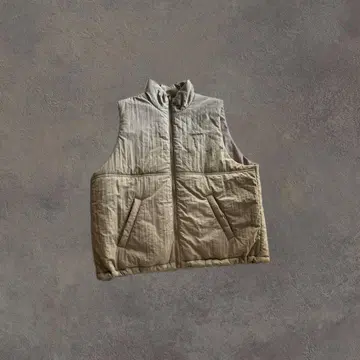 베이지 슬리브리스 다운 베스트