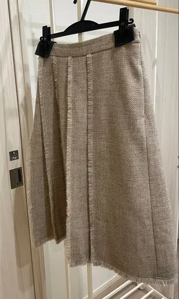 DRAWER 드로어 울 실크 프론트 턱 플리츠 프린지 스커트