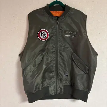 MARK GONZALES 카키 올리브 베스트 what it isNt