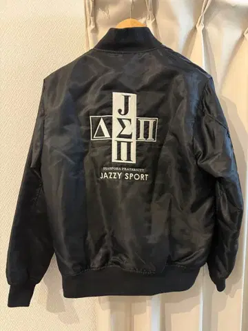 JAZZY SPORT x Diaspora 플라이트 자켓 블랙