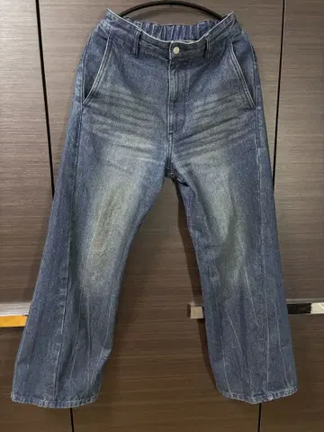 CURVED FLARE DENIM SLACKS