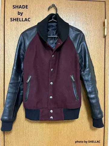 SHADE by SHELLAC 멜톤 울 x 가죽 소재 절개 바시티 자켓