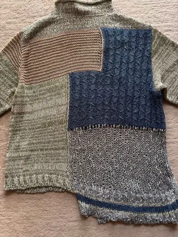 센소유니코 지우 슬라브 링 니트 비대칭 스웨터