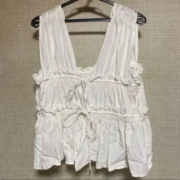 DISCOAT 개더 리본 사용 슬리브리스 블라우스