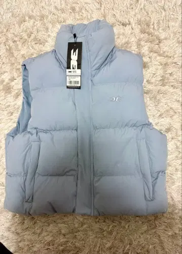 Elite eleven 라이트 블루 슬리브리스 다운 베스트