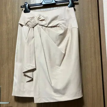 JUSGLITTY 프론트 리본 미니 스커트 핑크 베이지