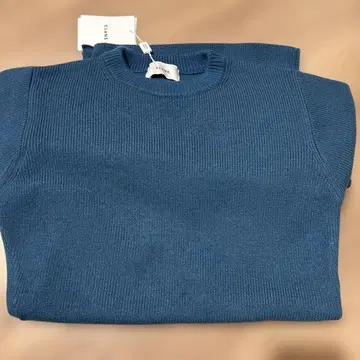 CLANE SLANT CUT KNIT TOPS