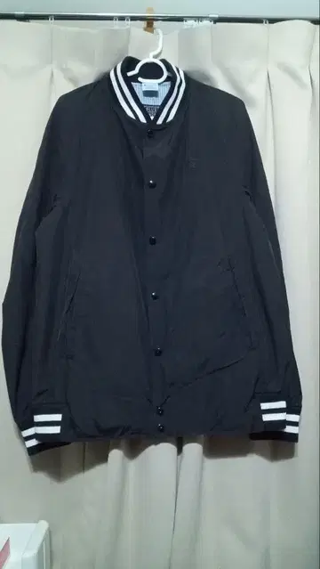 TOMORROWLAND x Champion 콜라보 바시티 자켓