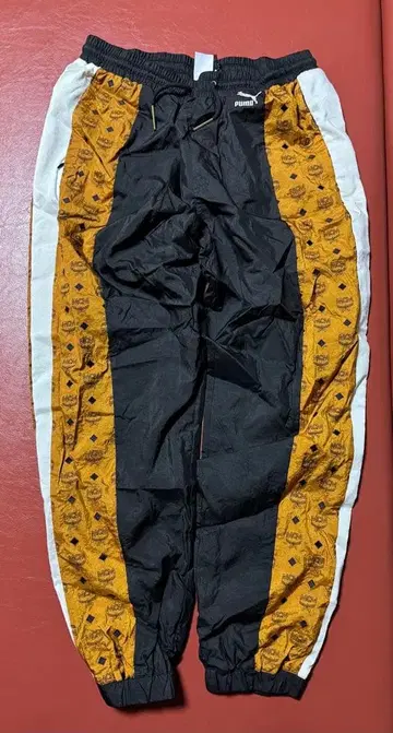 PUMA MCM 트랙 팬츠 블랙/오렌지 L