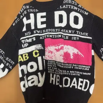 그래픽 프린트 긴팔 니트 스웨터 블랙