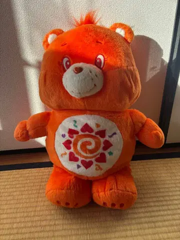 오렌지 컬러 케어베어 봉제 인형