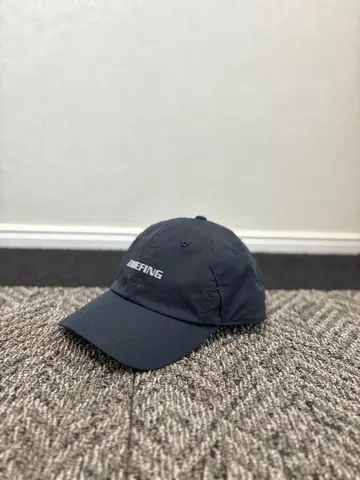 BRIEFING 블랙 캡 로고