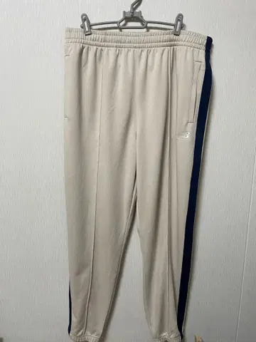 New Balance 트랙 조거 팬츠 베이지 네이비