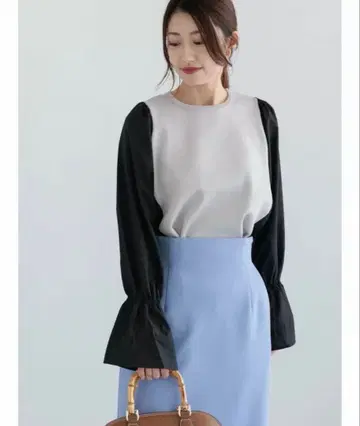 그레이와 블랙의 긴팔 상의 가격표 포함