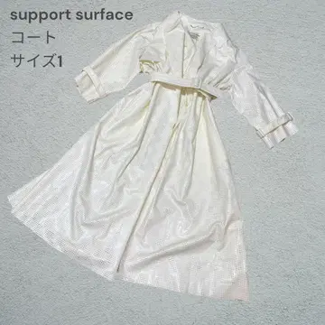 서포트 서페이스 펀칭 코트 화이트