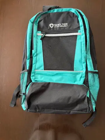 SHELTER 메쉬 포켓 부착 백팩 블랙 터콰이즈