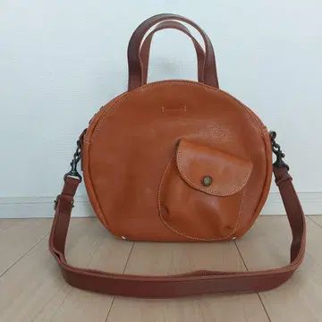 오렌지 원형 숄더백