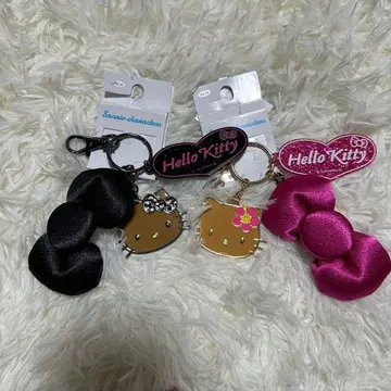 헬로키티 리본 백참 블랙 핑크 일광화상 아베일 산리오