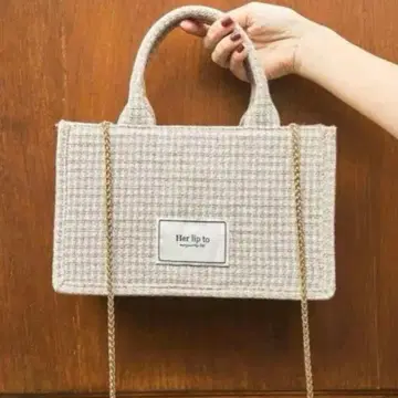 Her lip to Tuileries Tote Bag