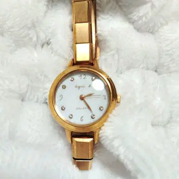 agnes b. 시계 솔라 골드 마르셀로