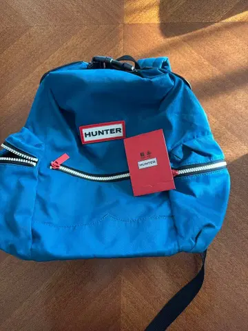 HUNTER 파랑 백팩 지퍼 포켓 부착