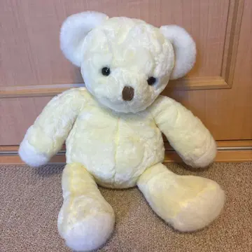 연한 옐로우 컬러의 곰 모양 봉제 인형 약 30cm