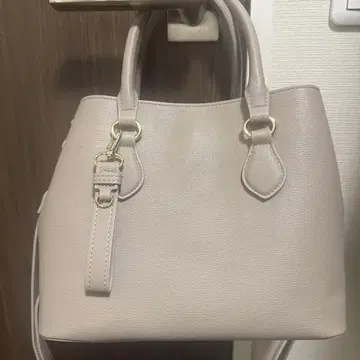 쿠 드 샹스 라이트 그레이 로치 백