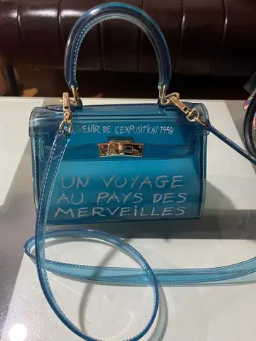 파란색 투명 숄더백 UN VOYAGE
