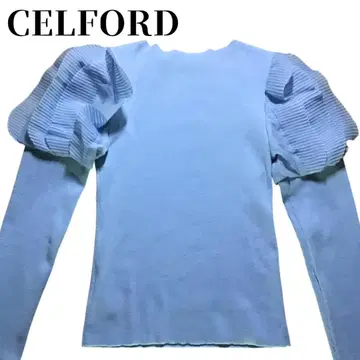 CELFORD 라이트 블루 퍼프 슬리브 니트 상의