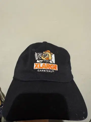 XLARGE 카니발 캐릭터 캡 블랙