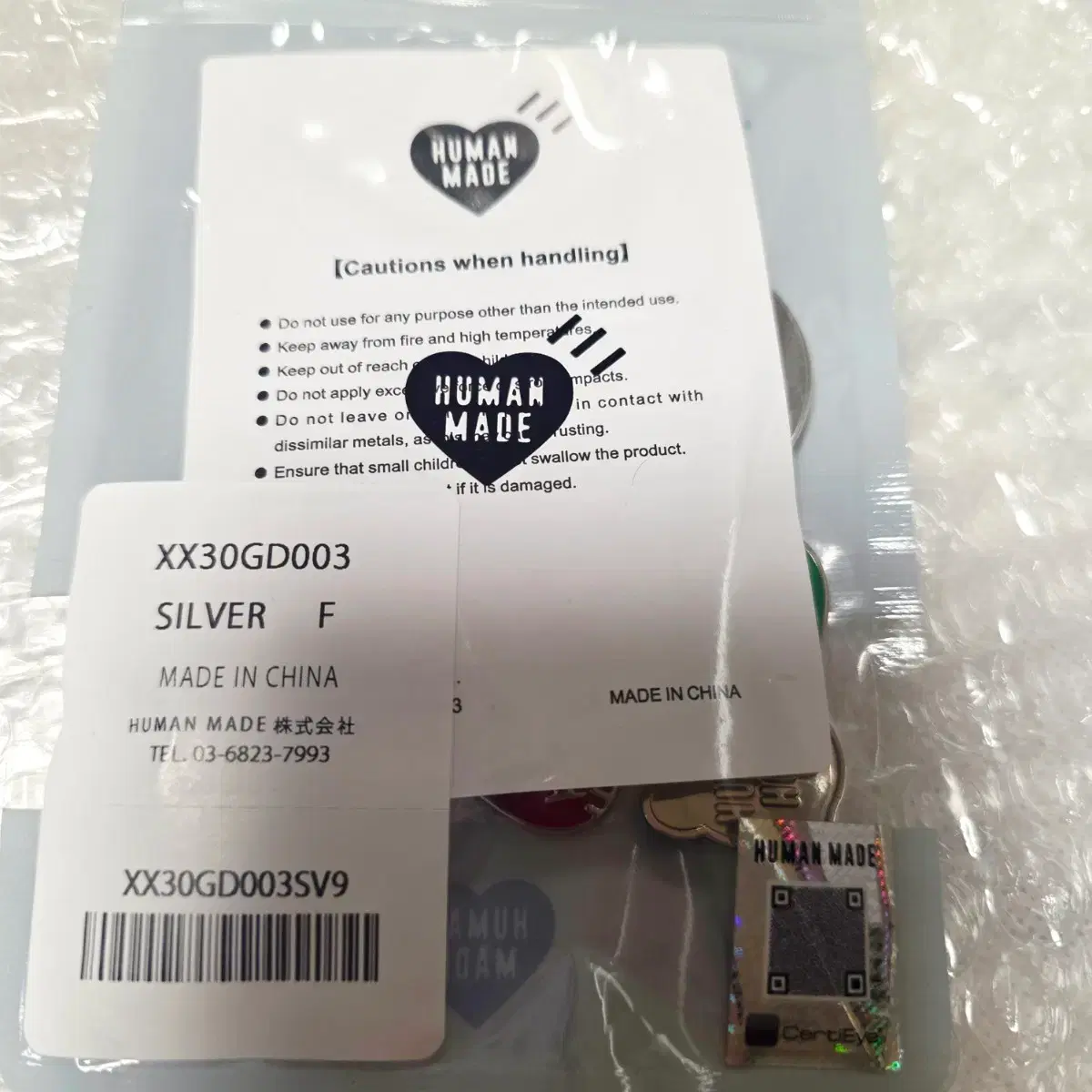 HUMAN MADE × j-hope HUMAN HOPE Key Charm HUMAN MADE HUMAN HOPE KEY CHARM – HUMAN MADE Inc.