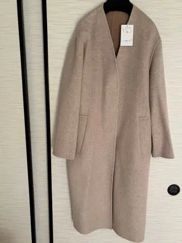 피노레 미사용 새상품 울 혼방 베이지 노카라 코트 40 사이즈