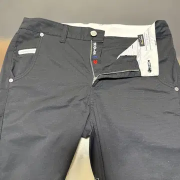 MARK & LONA 블랙 골프 팬츠 스컬 디자인