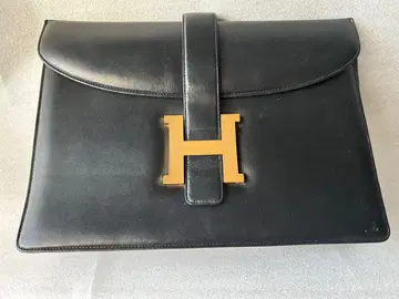 H 로고 블랙 가죽 클러치백