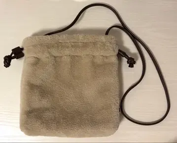 Nissy Naptime. 복조리 퍼 백 베이지