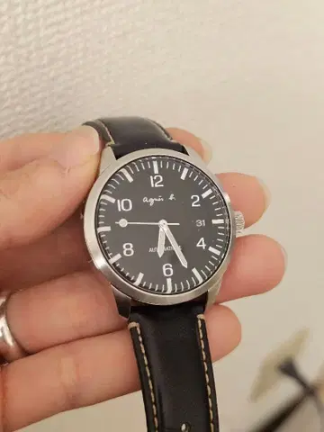 AGNES B. 애니스베. 데이트 뒷면 투명 자동 와인딩 남성용 손목시계