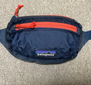 파타고니아 라이트웨이트 트래블 미니 힙 팩 네이비