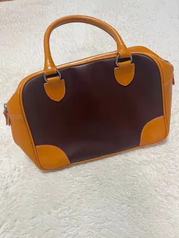 브라운 오렌지 가죽 핸드백