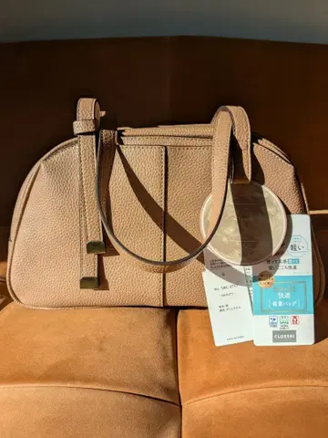 tal. 크로시 콜라보 베이지 핸드백 합성 피혁