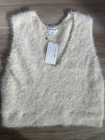 아이보리 V넥 슬리브리스 니트 M 사이즈