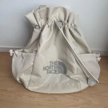 THE NORTH FACE 드로우 스트링 백 크림
