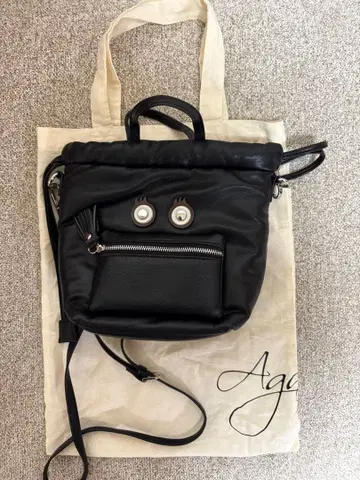 NOUER 블랙 숄더백 얼굴 디자인